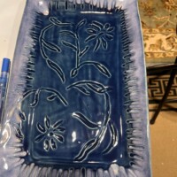 thick floral pattern on a tray in deep blue