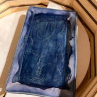 light floral pattern on a tray in deep blue