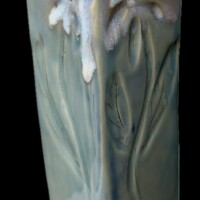 square green and white ceramic vessel with carved daisy styling