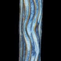 powder blue vessel with carved wavy cutaway