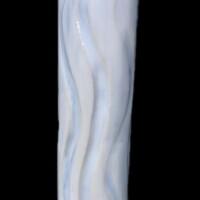 tubular vessel with carved wavy cutaway