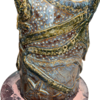 ceramic vessel with octopus and star fish circle and seed textures